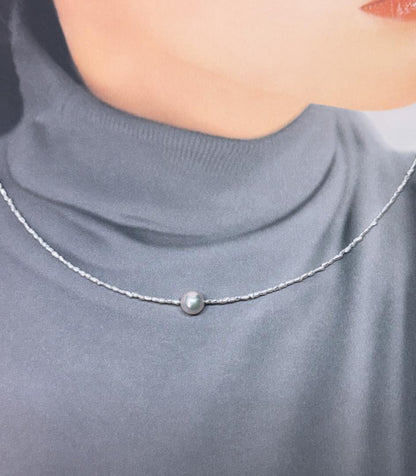 Akoya Keshi Necklace featuring small baroque pearls and a greenish pink Akoya pearl on a 42cm wire finish chain with metal clasp