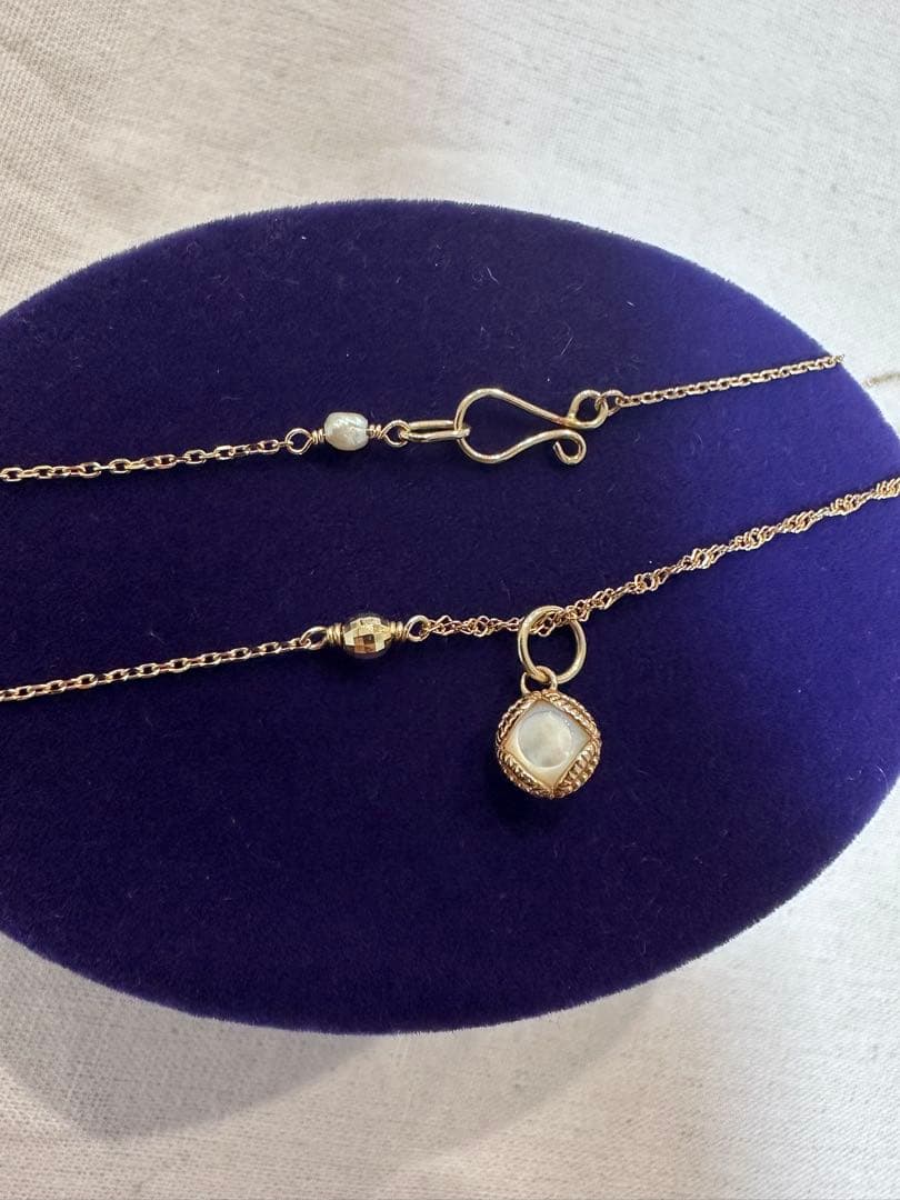 Agete Limited Edition K10 necklace bracelet charm with rose quartz front and white shell back on 40 cm adjustable chain