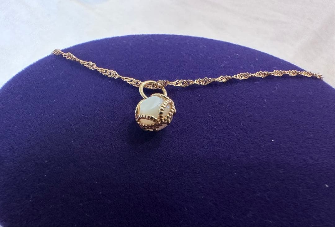 Agete Limited Edition K10 necklace bracelet charm with rose quartz front and white shell back on 40 cm adjustable chain