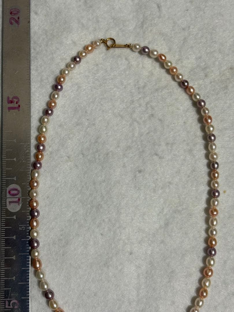 Tasaki K18 freshwater pearl necklace measuring 7.9 inches with elegant white pearls on gold chain