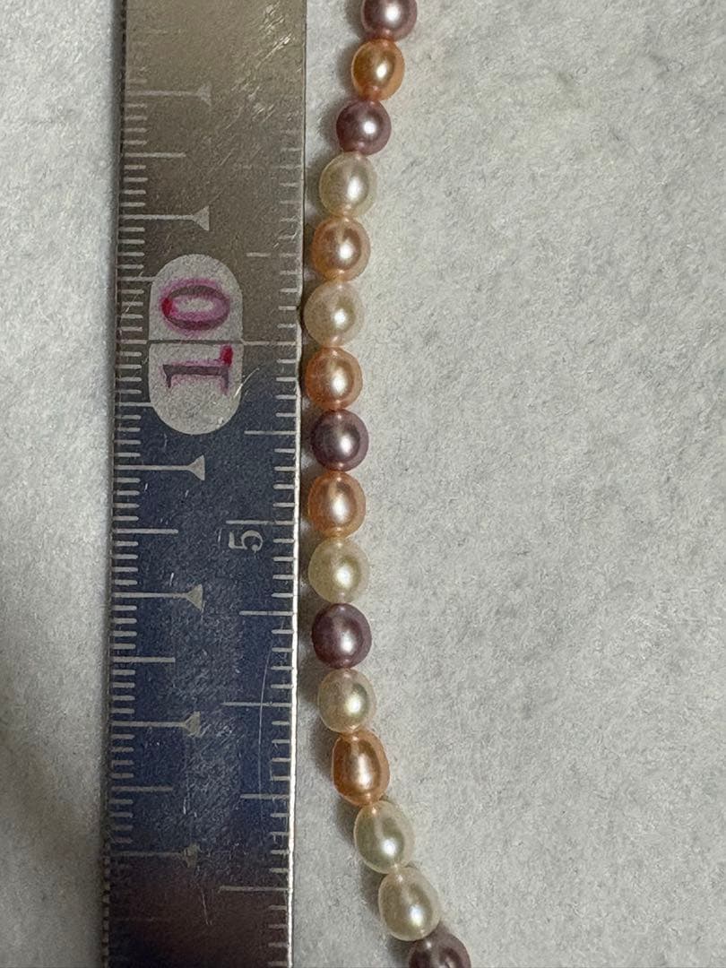 Tasaki K18 freshwater pearl necklace measuring 7.9 inches with elegant white pearls on gold chain