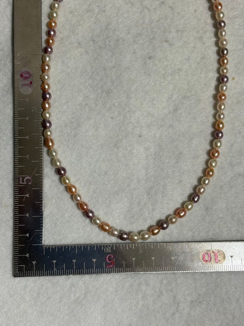 Tasaki K18 freshwater pearl necklace measuring 7.9 inches with elegant white pearls on gold chain