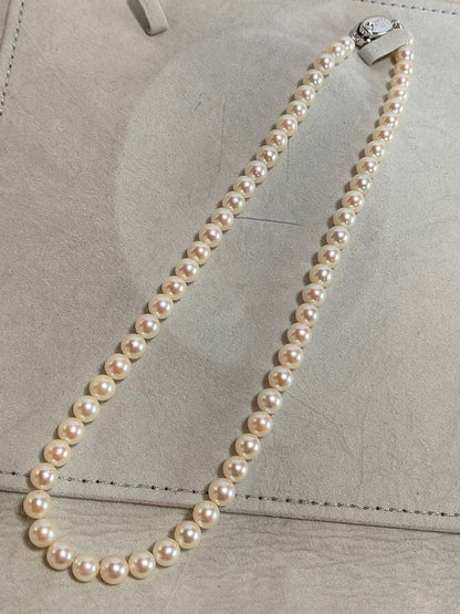 Akoya pearl necklace with 6.5-6.7mm white semi-round pearls and silver engraved bean-shaped clasp, 42.5cm length