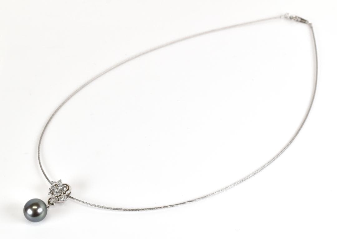 Tasaki necklace with one 9.3mm black pearl and six diamonds on white gold platinum chain