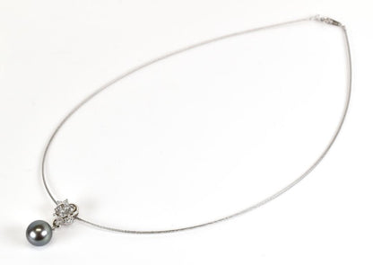 Tasaki necklace with one 9.3mm black pearl and six diamonds on white gold platinum chain