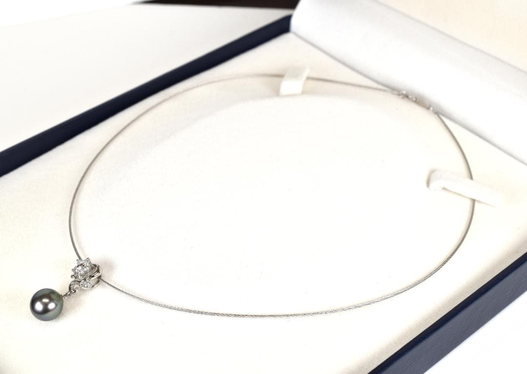 Tasaki necklace with one 9.3mm black pearl and six diamonds on white gold platinum chain