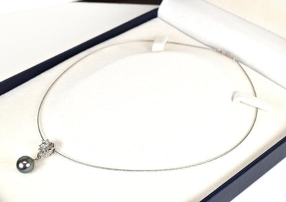 Tasaki necklace with one 9.3mm black pearl and six diamonds on white gold platinum chain