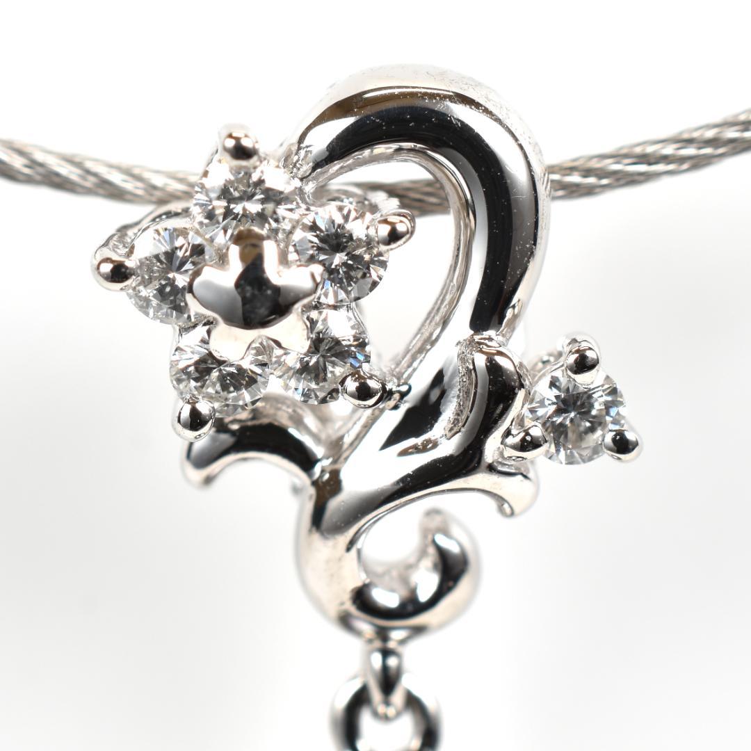 Tasaki necklace with one 9.3mm black pearl and six diamonds on white gold platinum chain