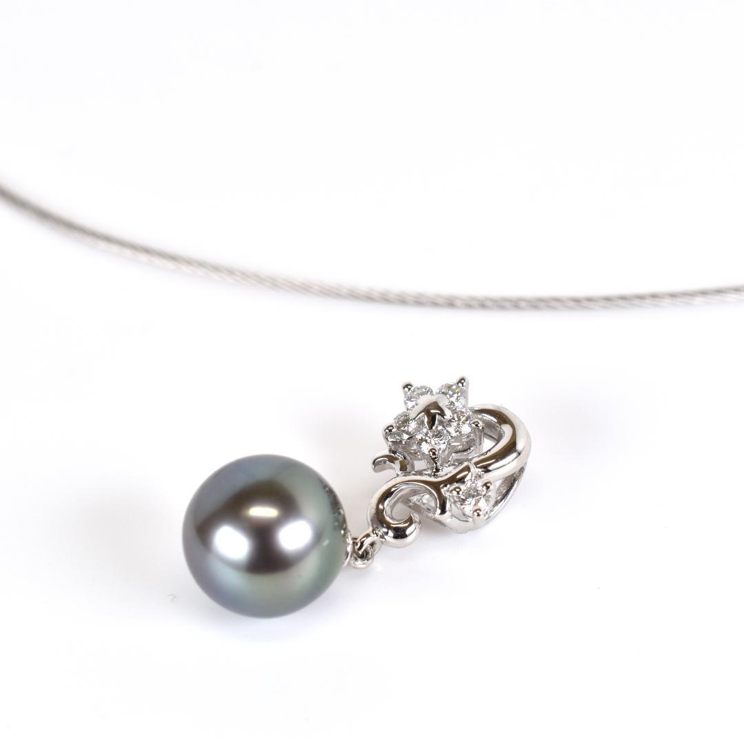 Tasaki necklace with one 9.3mm black pearl and six diamonds on white gold platinum chain