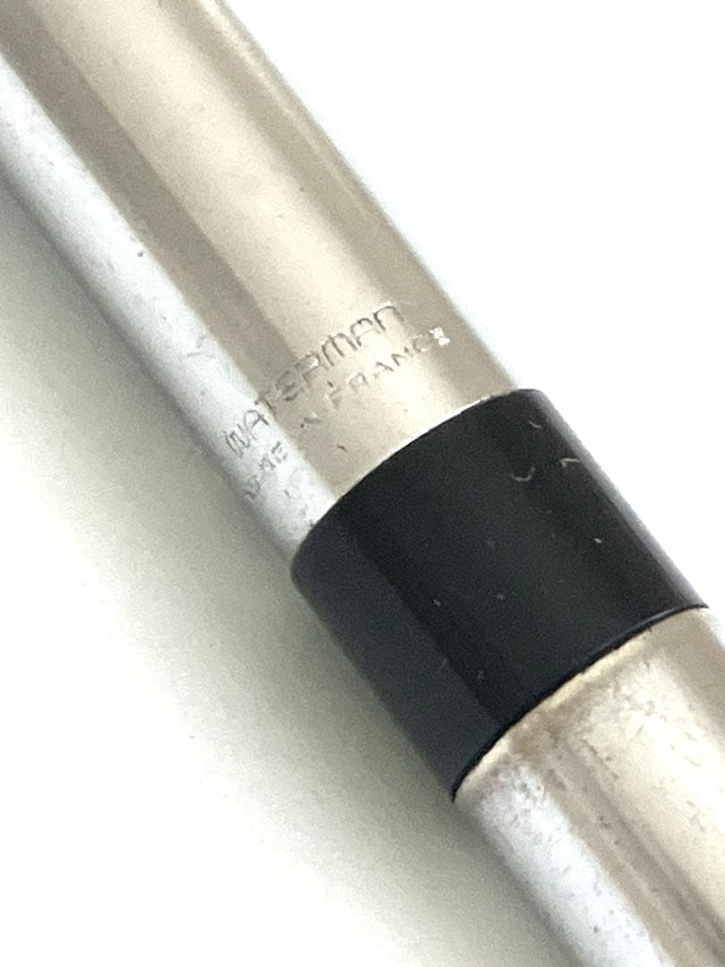 Waterman vintage ballpoint pen from 1970s with old logo on cap metal body showing light wear and scratches