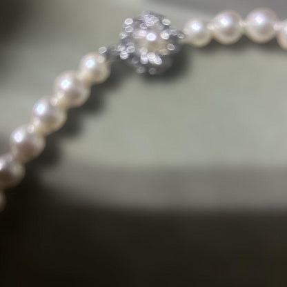 Akoya pearl necklace with 7mm pearls and removable silver clicker clasp in simple elegant design