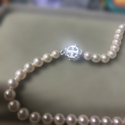 Akoya pearl necklace with 7mm pearls and removable silver clicker clasp in simple elegant design