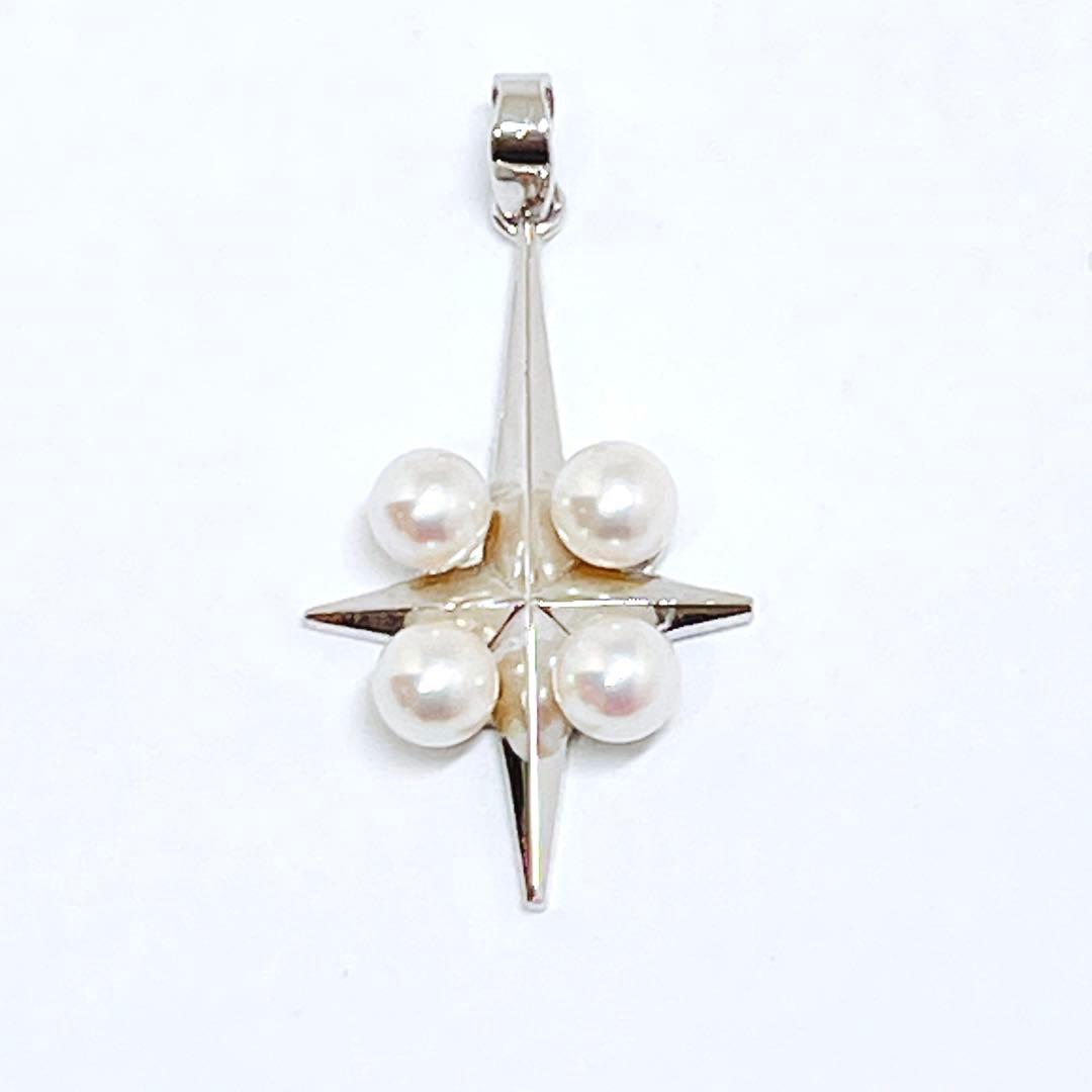 Mikimoto silver pendant necklace with four round pearls and a cross design