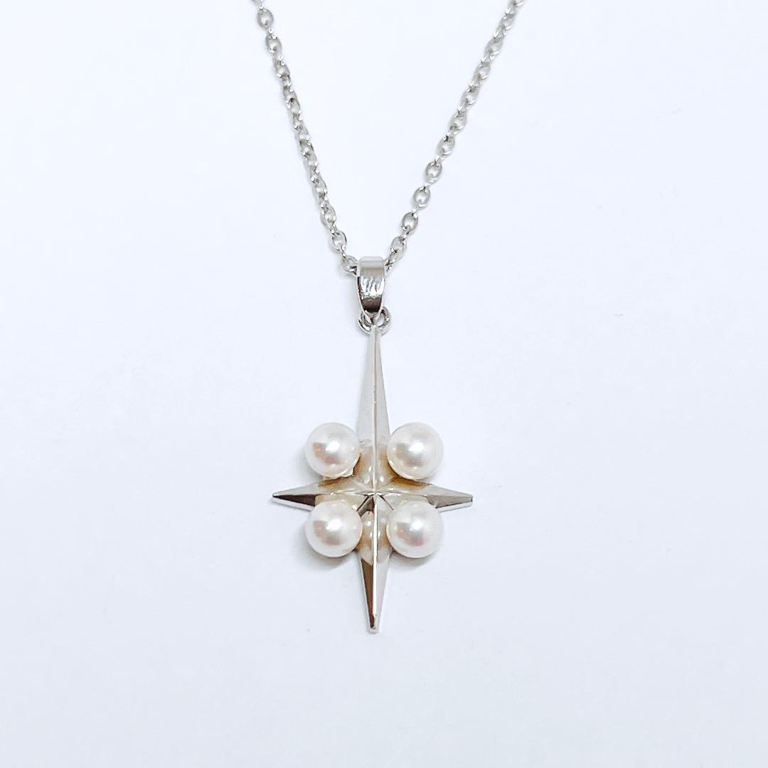 Mikimoto silver pendant necklace with four round pearls and a cross design