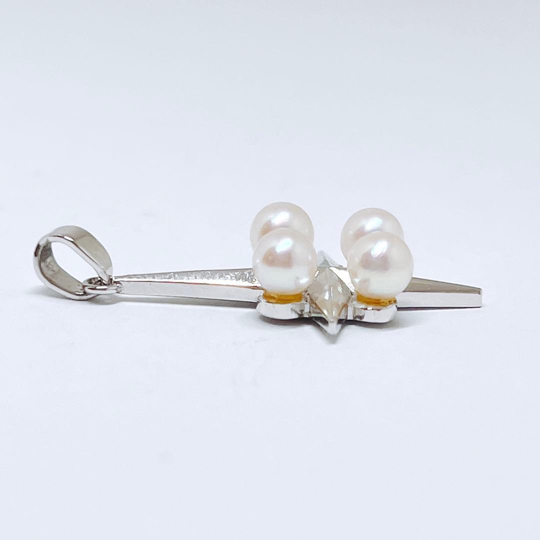 Mikimoto silver pendant necklace with four round pearls and a cross design