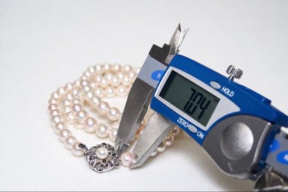 Akoya pearl long necklace with 7.0-7.22 mm pearls measuring 84 cm, displayed on a white background