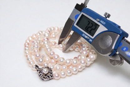 Akoya pearl long necklace with 7.0-7.22 mm pearls measuring 84 cm, displayed on a white background