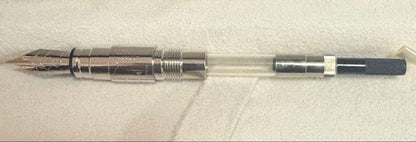 Waterman Perspectiv fountain pen with black body, silver trim, fine nib, and included case and ink cartridges