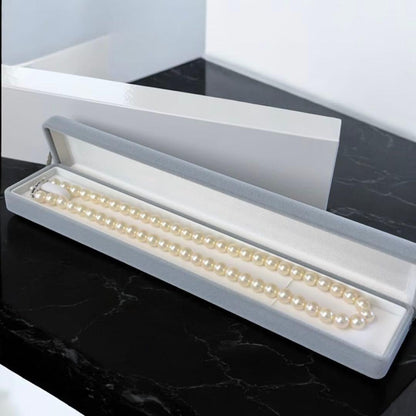 Takashi Akoya pearl necklace with 7.5mm round pearls and a K14 gold fastener on a white background