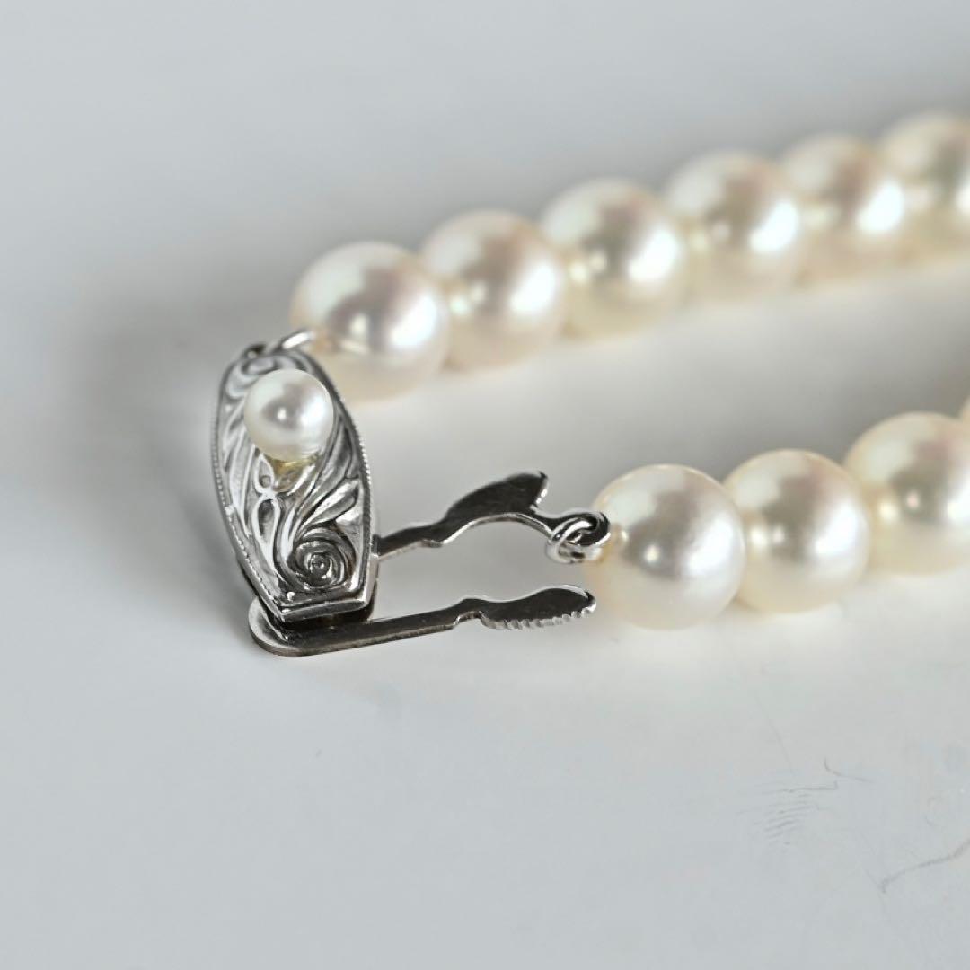 Takashi Akoya pearl necklace with 7.5mm round pearls and a K14 gold fastener on a white background