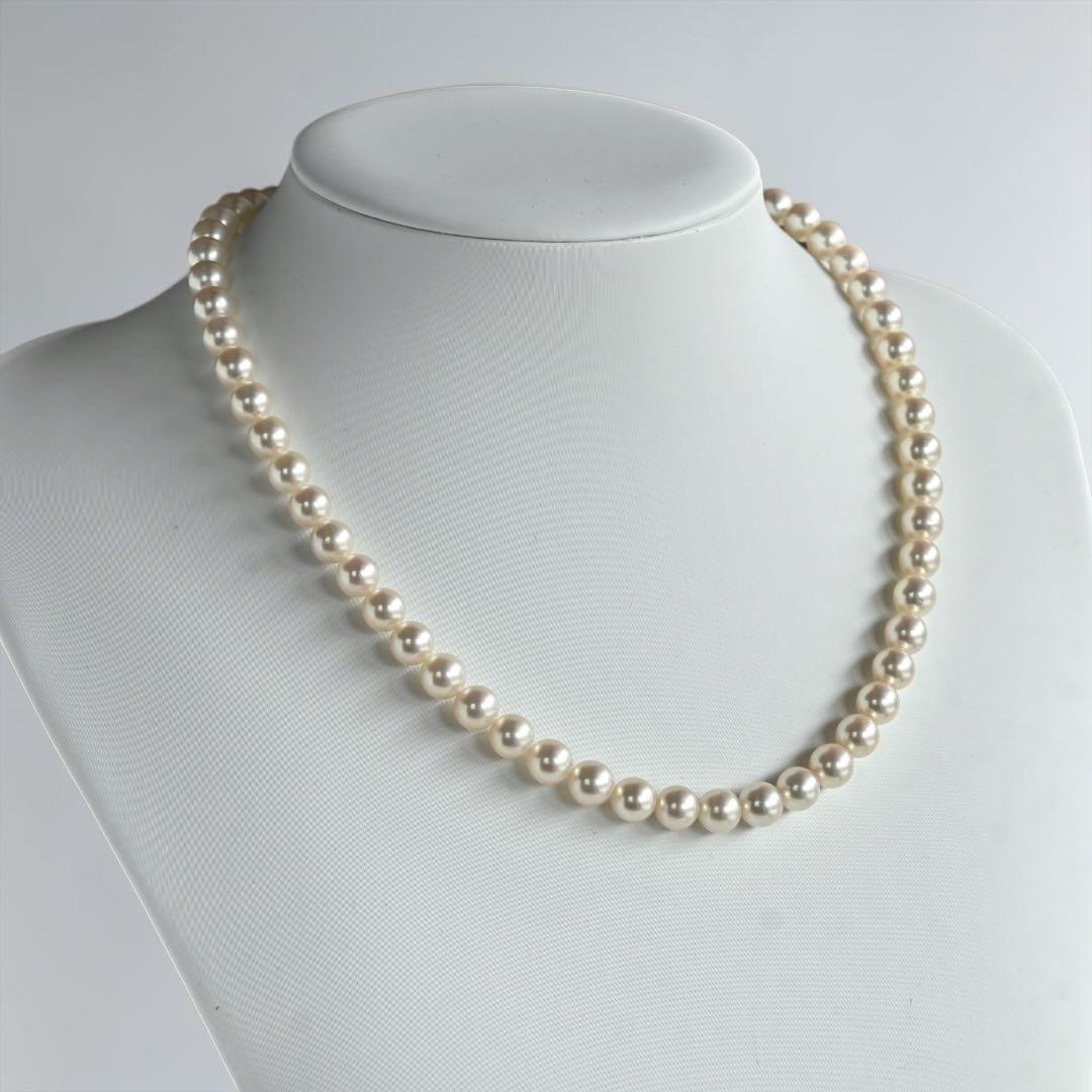 Takashi Akoya pearl necklace with 7.5mm round pearls and a K14 gold fastener on a white background