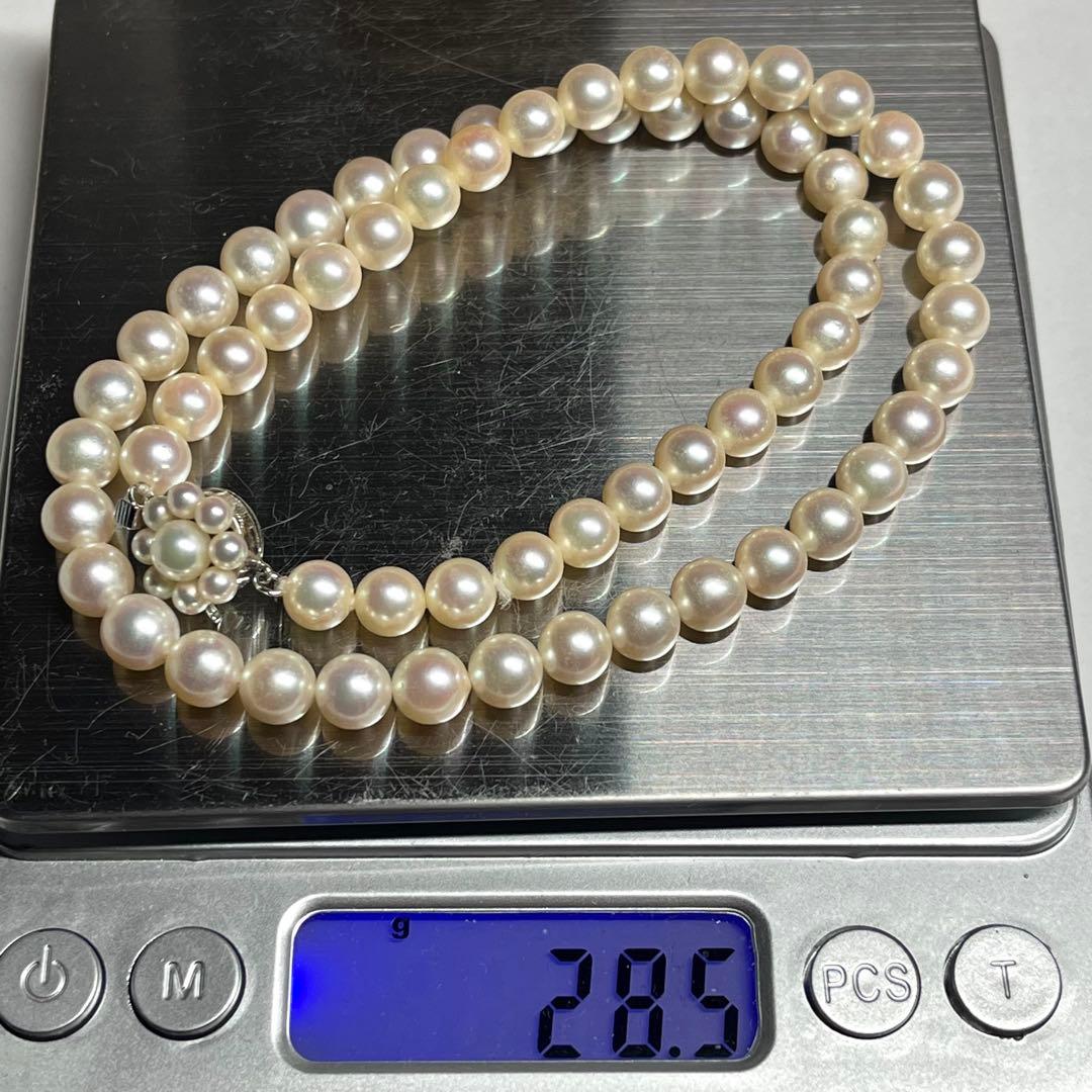 Polished Akoya pearl necklace with 6.5-7mm pearls, approximately 43 cm long, displayed on a white background