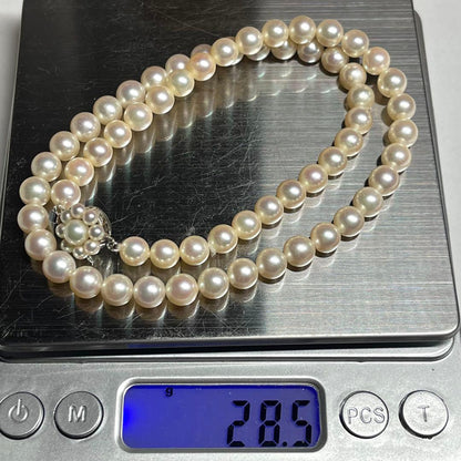 Polished Akoya pearl necklace with 6.5-7mm pearls, approximately 43 cm long, displayed on a white background