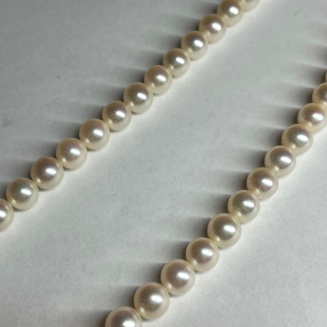 Polished Akoya pearl necklace with 6.5-7mm pearls, approximately 43 cm long, displayed on a white background