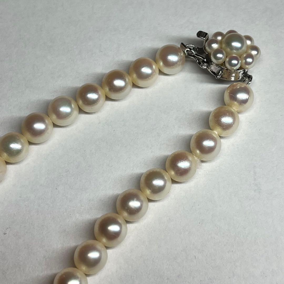 Polished Akoya pearl necklace with 6.5-7mm pearls, approximately 43 cm long, displayed on a white background