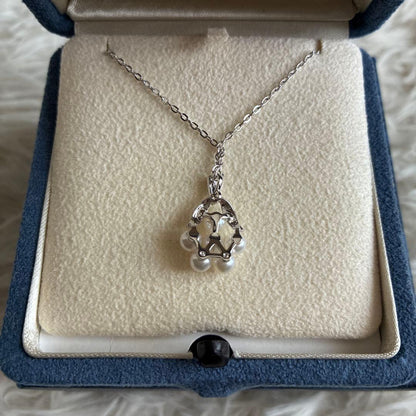 MIKIMOTO pearl necklace with 6 pearls, silver chain, flower motif, displayed with included box