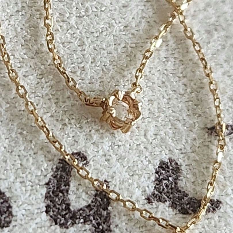 Law Rose Cut Diamond Necklace in K10 gold featuring a single 0.02 carat diamond