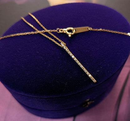 Agat K10 gold diamond bar necklace with 0.08 carat diamonds on a chain with engraving, displayed with box