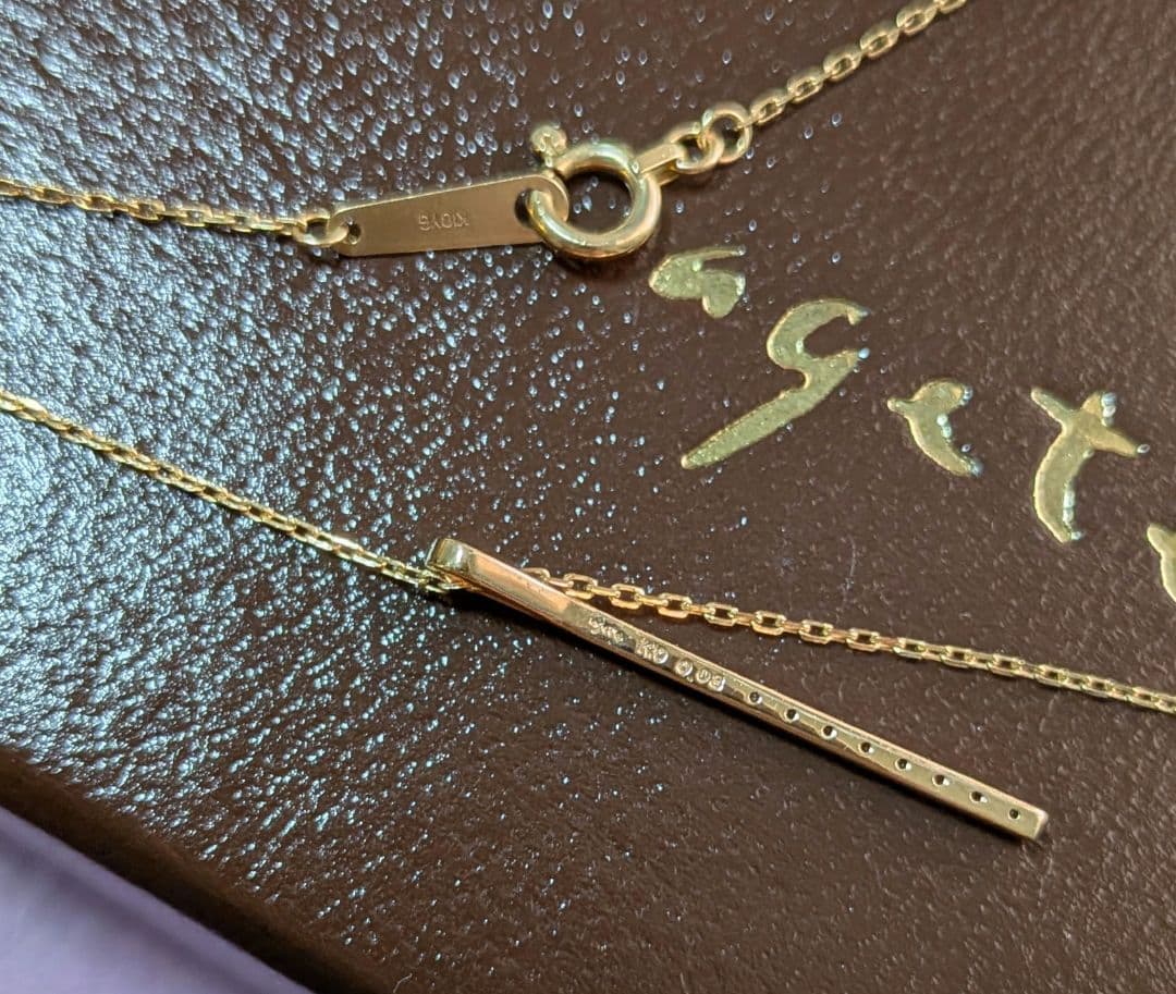 Agat K10 gold diamond bar necklace with 0.08 carat diamonds on a chain with engraving, displayed with box