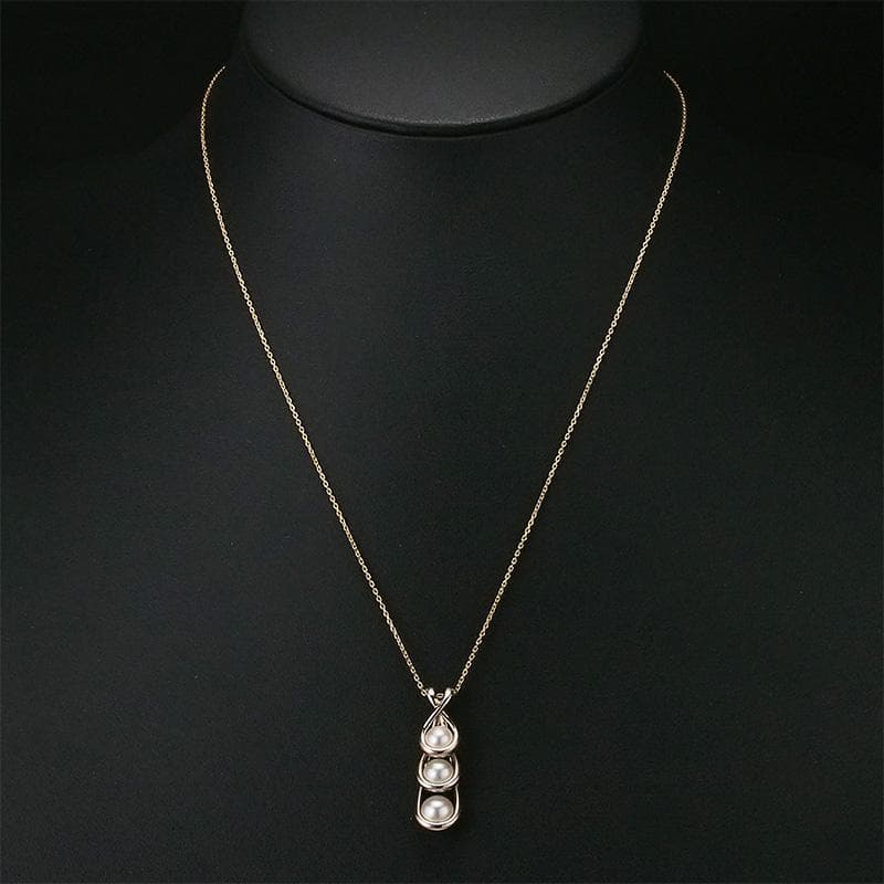 Tasaki K18 Sakura Gold 3P Pearl Necklace with three pearls and gold chain on white background