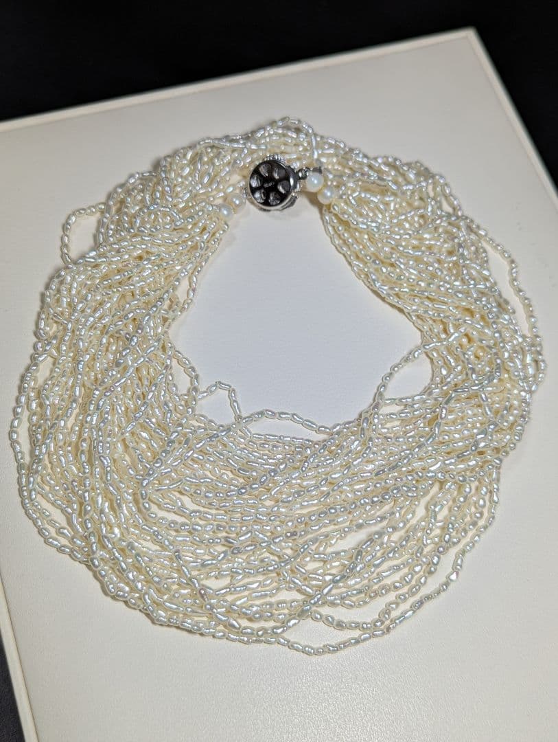 N107 Poppy 15-Strand Akoya Pearl Necklace with 2-4mm pearls and 62cm length displayed on a white background