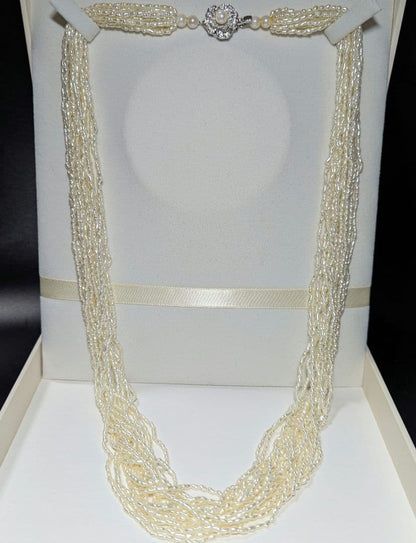 N107 Poppy 15-Strand Akoya Pearl Necklace with 2-4mm pearls and 62cm length displayed on a white background