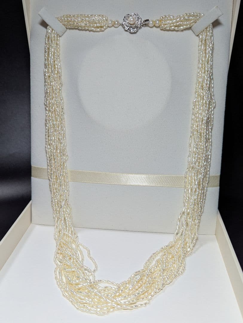 N107 Poppy 15-Strand Akoya Pearl Necklace with 2-4mm pearls and 62cm length displayed on a white background