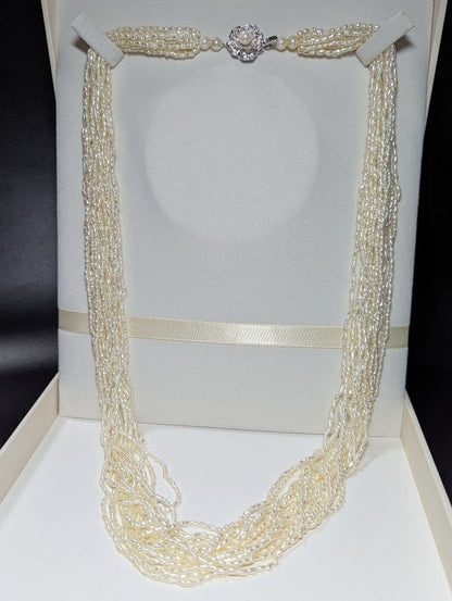 N107 Poppy 15-Strand Akoya Pearl Necklace with 2-4mm pearls and 62cm length displayed on a white background