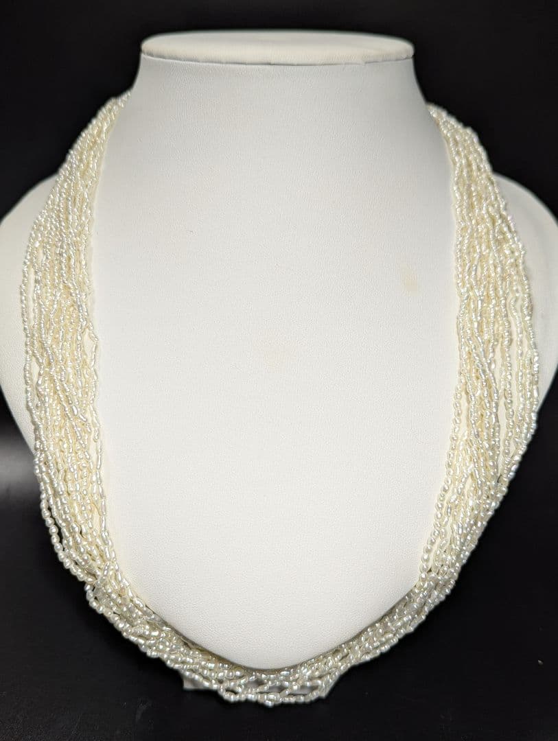 N107 Poppy 15-Strand Akoya Pearl Necklace with 2-4mm pearls and 62cm length displayed on a white background