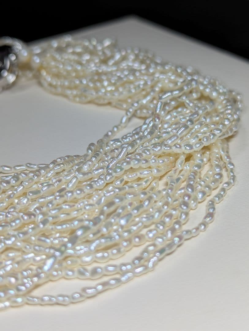 N107 Poppy 15-Strand Akoya Pearl Necklace with 2-4mm pearls and 62cm length displayed on a white background