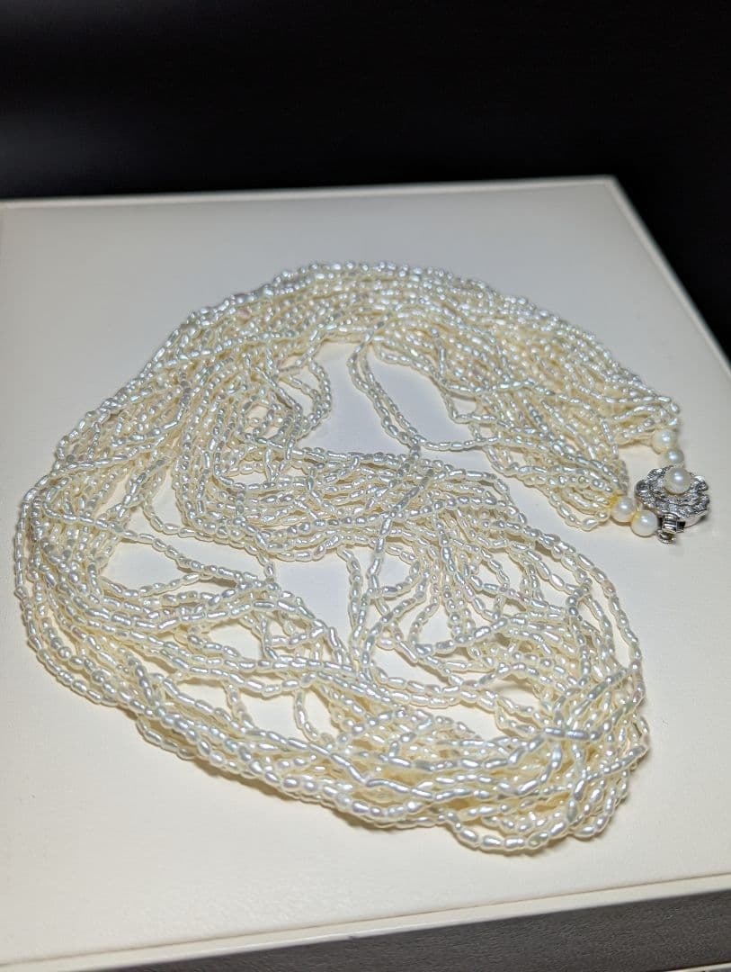 N107 Poppy 15-Strand Akoya Pearl Necklace with 2-4mm pearls and 62cm length displayed on a white background