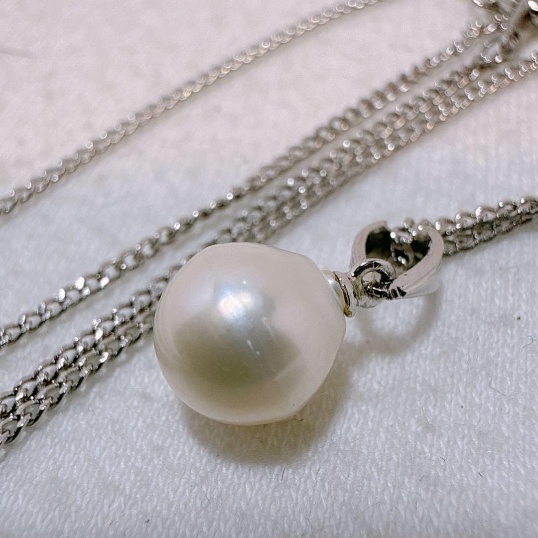 Tasaki necklace featuring a 7.8mm pearl pendant with silver material on a 40cm metal chain
