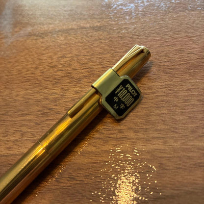 New PILOT fountain pen featuring an 18K gold nib with sleek black body and silver accents