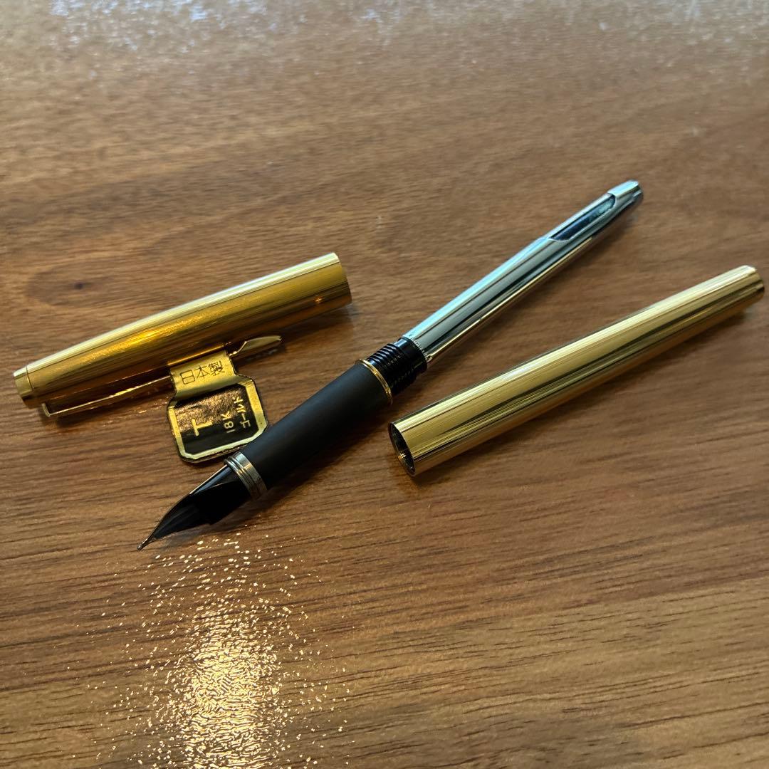 New PILOT fountain pen featuring an 18K gold nib with sleek black body and silver accents