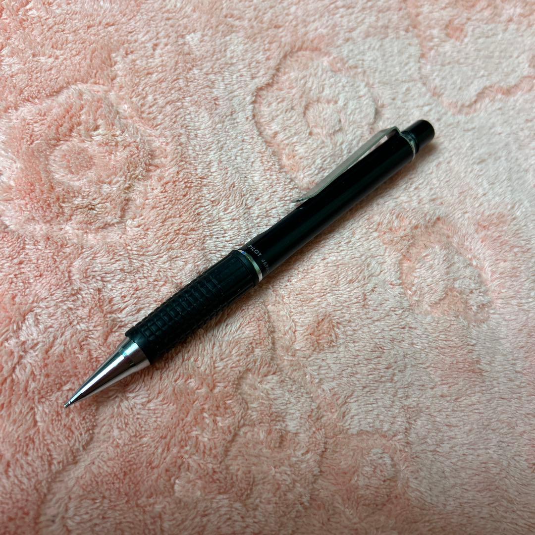 Pilot GIMNO Black pen featuring metal tip, rubber grip, and simple black plastic and metal body