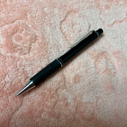 Pilot GIMNO Black pen featuring metal tip, rubber grip, and simple black plastic and metal body