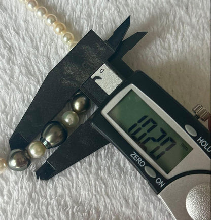 Silver necklace with 7.9-10mm Black Lip South Sea and Akoya pearls, 43.5cm length, displayed on white background