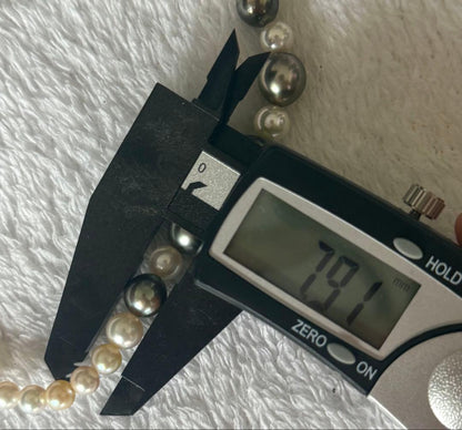 Silver necklace with 7.9-10mm Black Lip South Sea and Akoya pearls, 43.5cm length, displayed on white background