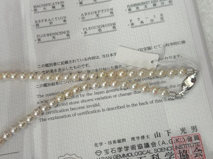 Silver necklace with 7.9-10mm Black Lip South Sea and Akoya pearls, 43.5cm length, displayed on white background