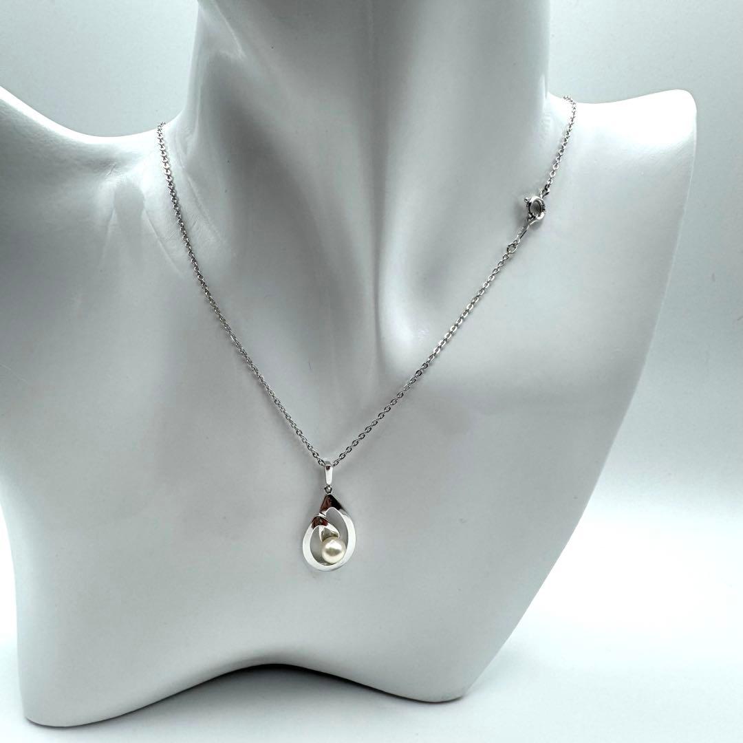 Mikimoto Akoya pearl necklace with silver teardrop pendant, silver chain, and red storage box